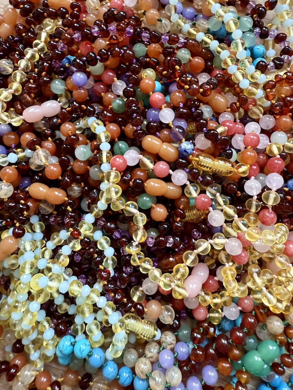 Amber natural Baltic baby and toddler teething jewellery brand logo