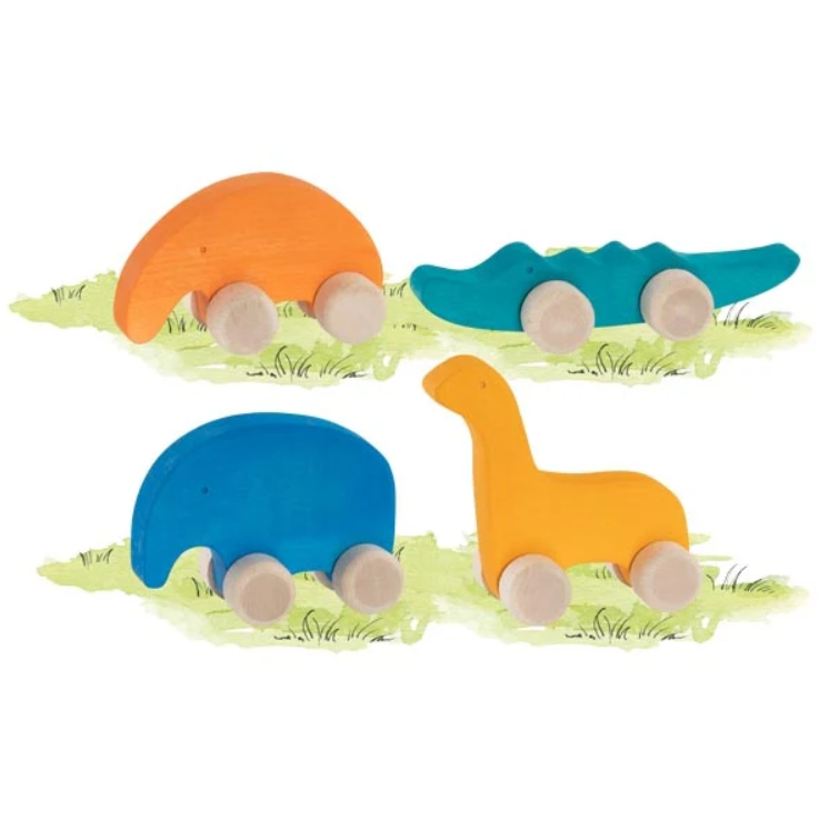 Set of colorful wooden toy dinosaurs on a grassy background