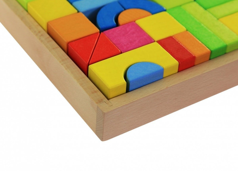 Colorful wooden puzzle blocks in a wooden frame on a white background