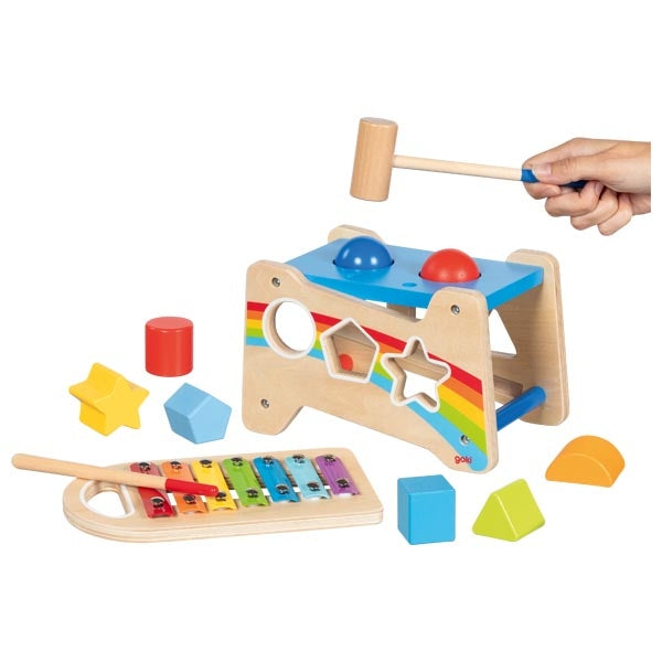 Wooden toy with colorful shapes and a hammer on a white background