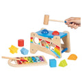 Wooden toy with colorful shapes and a hammer on a white background