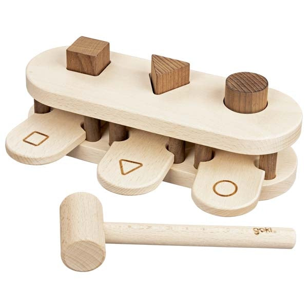 Wooden shape sorting toy with a hammer on a white background