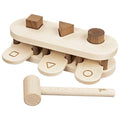 Wooden shape sorting toy with a hammer on a white background