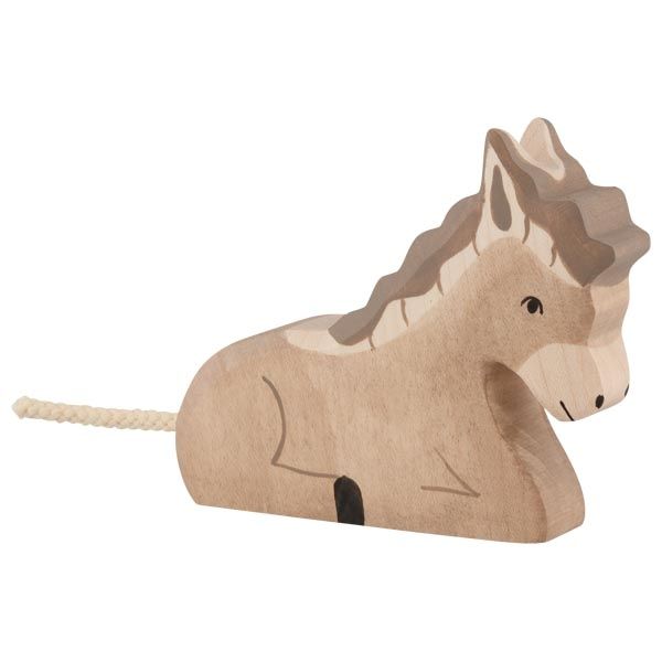 Wooden horse toy with a rope on a white background