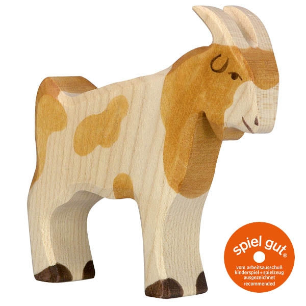 Wooden goat toy with 'spiel gut' certification label on a white background
