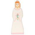 Decorative Toy figurine of a woman with a rose on a white background