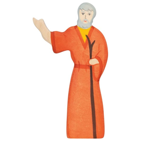 Figurine of a person in an orange robe with a staff on a white background