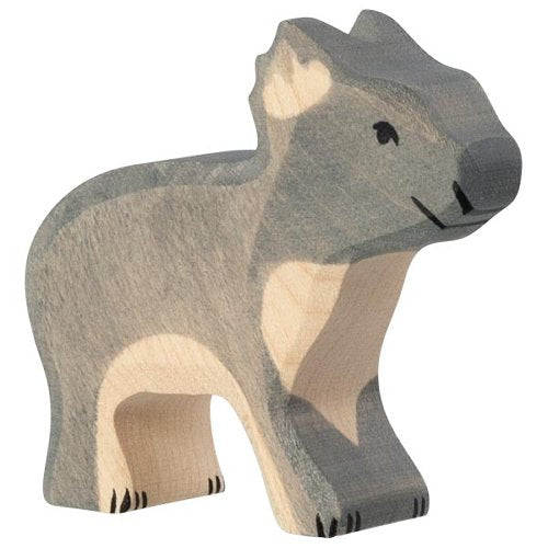 Wooden bear figurine with a natural wood finish on a white background