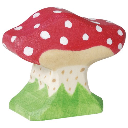 Wooden mushroom toy with red cap and white spots on a green base