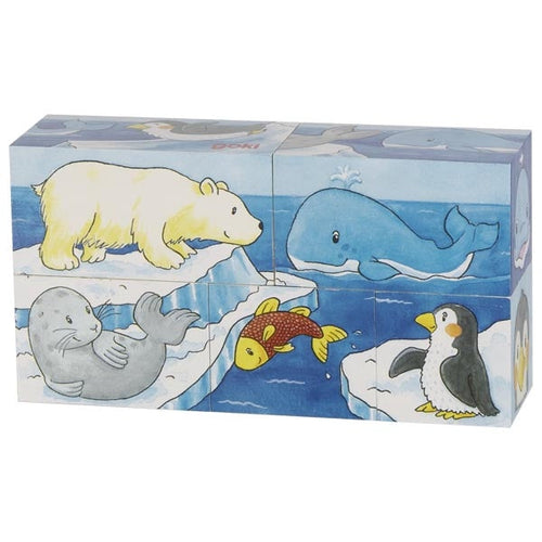 Set of animal-themed building blocks with polar bear, whale, seal, fish, penguin, and whale on a blue water background.