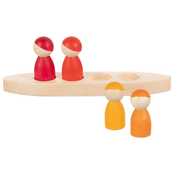 Wooden toy with peg figures on a white background