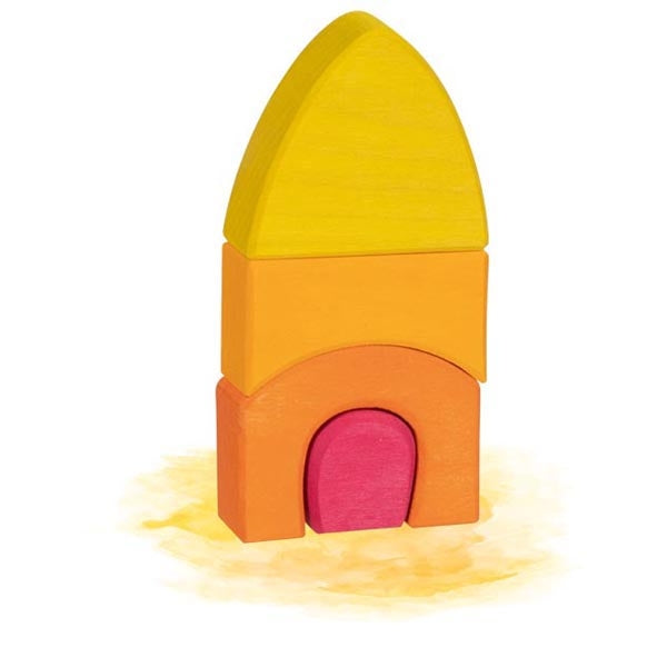 Colorful toy rocket with a yellow top and orange body on a white background