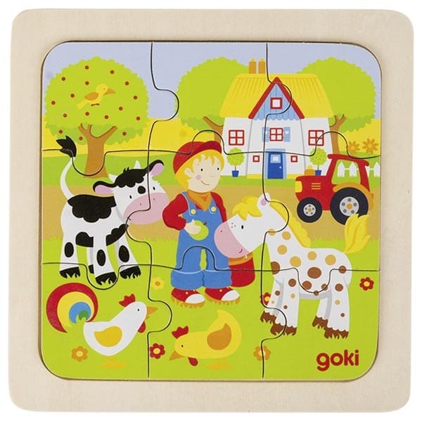 Children's puzzle with farm-themed design featuring a boy, cow, horse, and tractor.