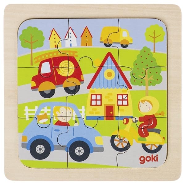 Children's puzzle with colorful cars and houses, featuring the brand 'goki'.