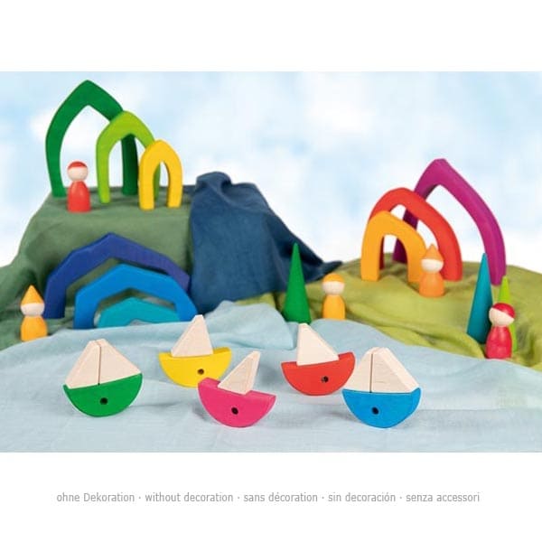 Colorful wooden toy set with boats, arches, and figures on a blue background