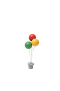 A small decorative figure featuring three colourful wooden balloons in red, green, and yellow, mounted on a grey wooden base.