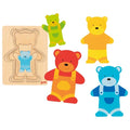 Set of colorful bear-shaped toys with a wooden puzzle on a white background