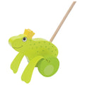 Green frog-shaped pull toy with a yellow crown on a white background