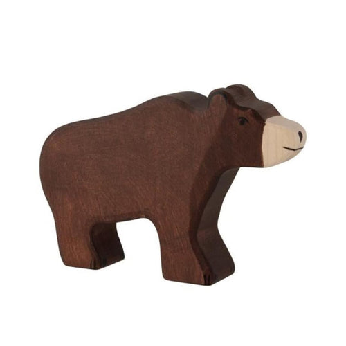 Brown bear figurine on a beige background