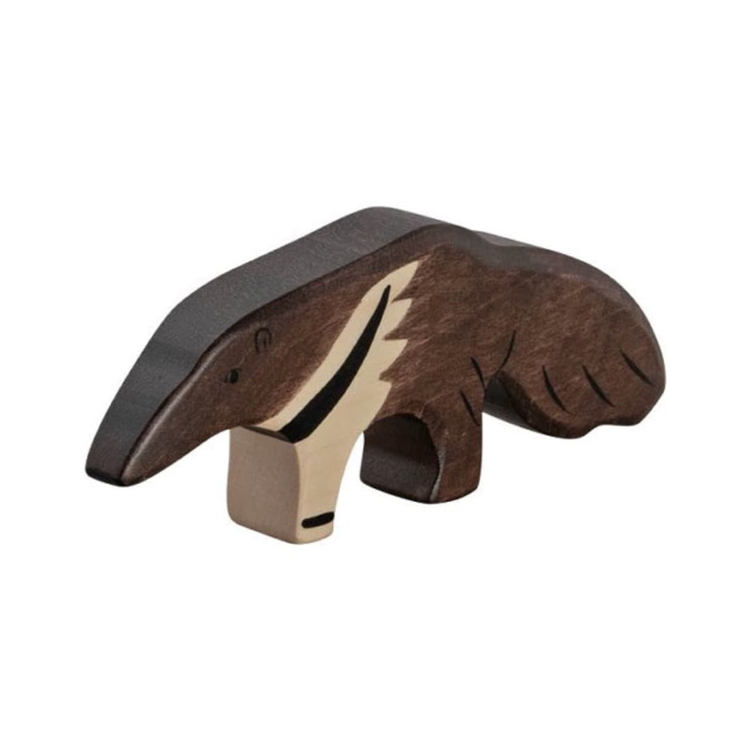 Wooden ant figurine on a beige background