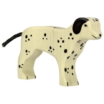 Wooden dog figurine with black spots on a white background