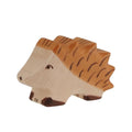 Wooden toy hedgehog on a beige background by German brand Holztiger