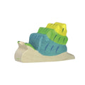 Wooden toy figure of a snail with a green and blue shell on a white background